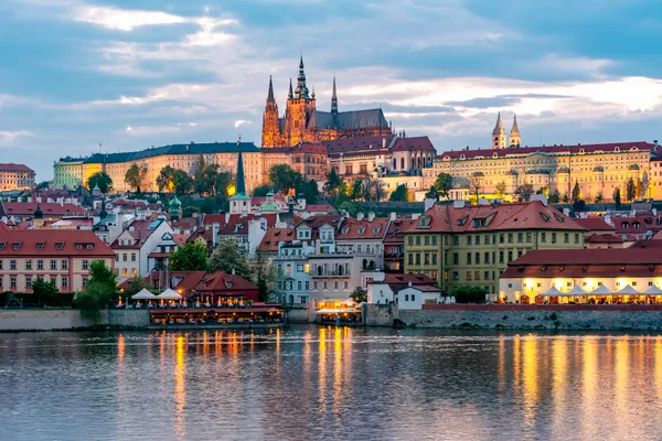 Prague Castle with St. Vitus Cathedral over Lesser town (Mala Strana) at sunset, Czech Republic